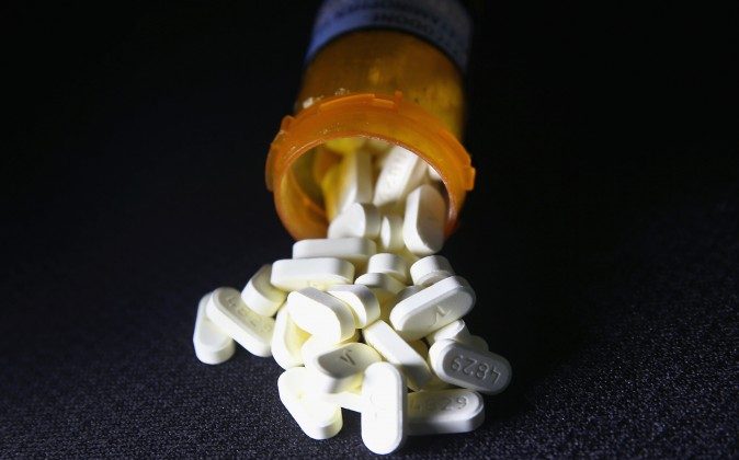 Oxycodone pain pills prescribed for a patient with chronic pain lie on display. (John Moore/Getty Images)