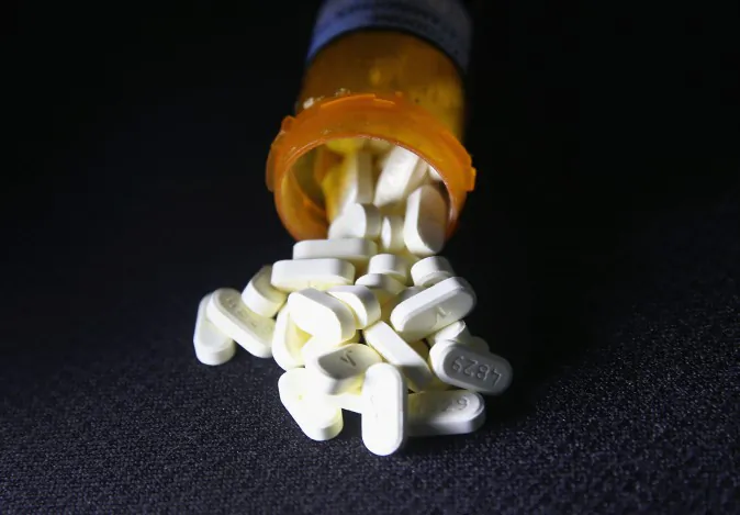 Oxycodone pain pills prescribed for a patient with chronic pain lie on display. (John Moore/Getty Images)