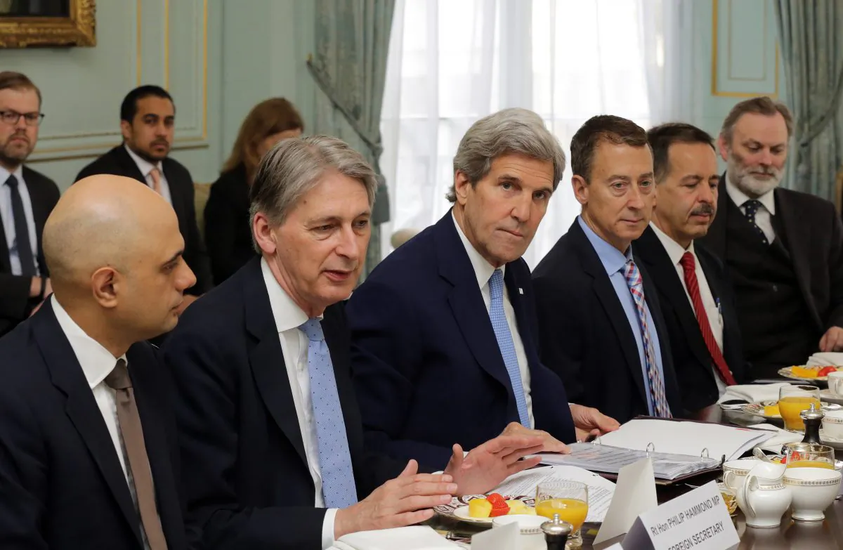 U.S. Secretary of State John Kerry, center, and Britain's Foreign Secretary Phillip Hammond, second left, attend a meeting in central London, Thursday May 12, 2016. (Paul Hackett/Pool via AP)