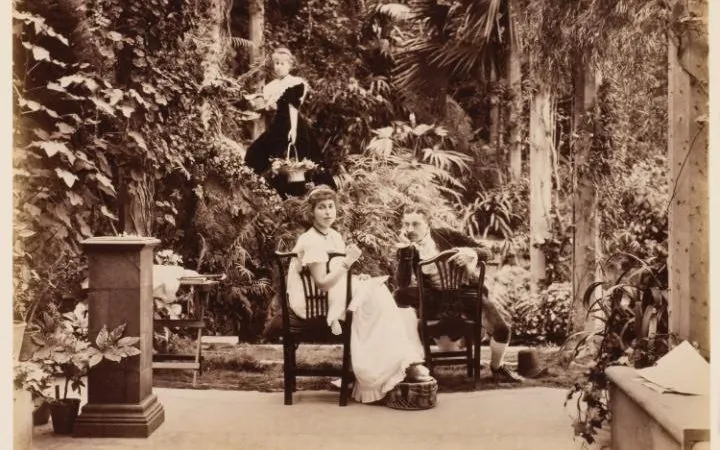 HRH Princess Alexandra, HRH Princess Victoria & Mr Savile, ‘Two’s company and three’s none’ in
‘Tableaux Vivants Devonport’ c1892-1893, by unknown photographer. (Courtesy of Wilson Centre for Photography)