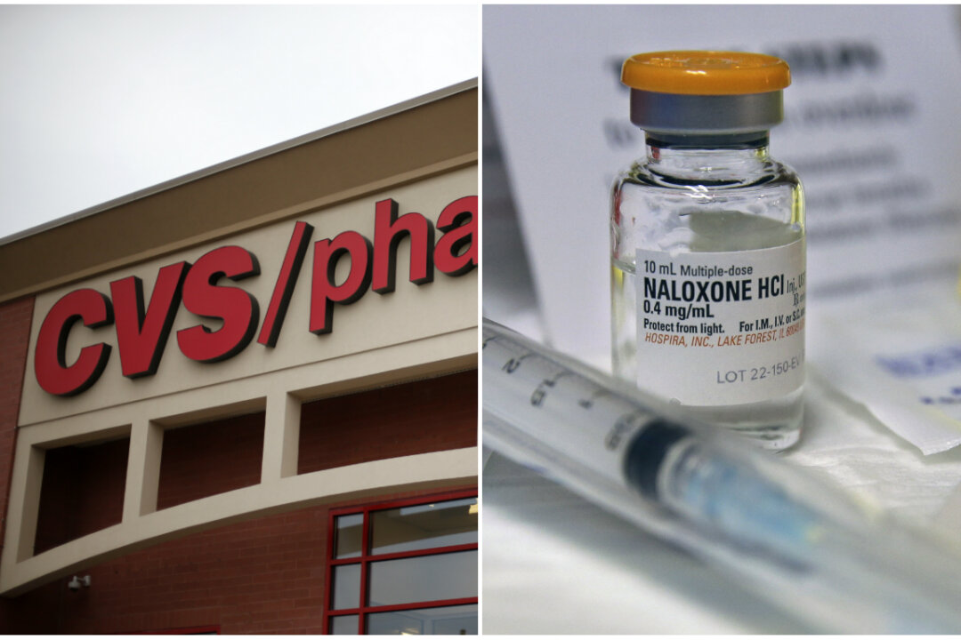 A CVS/Pharmacy in Dormont, Pa., March 17, 2014. (AP Photo/Gene J. Puskar, File) and a small bottle of the opiate overdose treatment drug, naloxone, also known by its brand name Narcan, on Feb. 19, 2014. (AP Photo/Mel Evans,file)