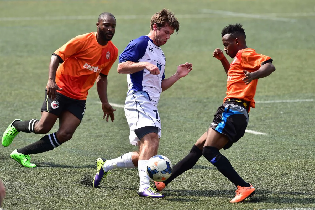 Football action in an early season match between Albion and Corinthians in the HKFA first division at Sports Road on Oct 18, 2015. (Bill Cox/Epoch Times)