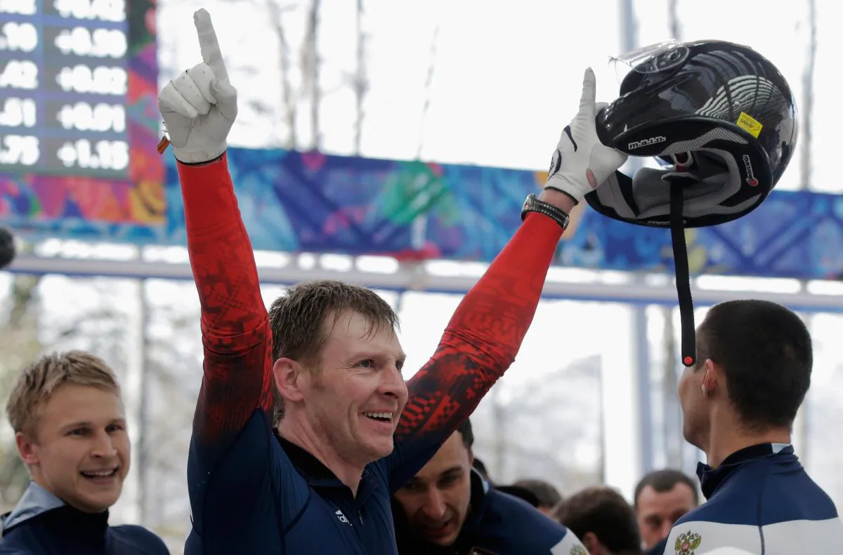 Pilot Alexander Zubkovof Russia team 1 celebrates winning the gold medal during the Men's Four-Man Bobsleigh on Day 16 of the Sochi 2014 Winter Olympics at Sliding Center Sanki on February 23, 2014 in Sochi, Russia.  (Photo by Adam Pretty/Getty Images)