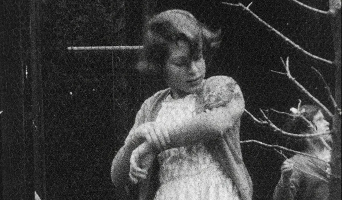 This undated handout photo provided by HM The Queen shows the then Princess Elizabeth with a bird on her arm, in Britain. Rare footage of Britain's Queen Elizabeth has been shared to celebrate her 90th birthday. (HM The Queen via AP)