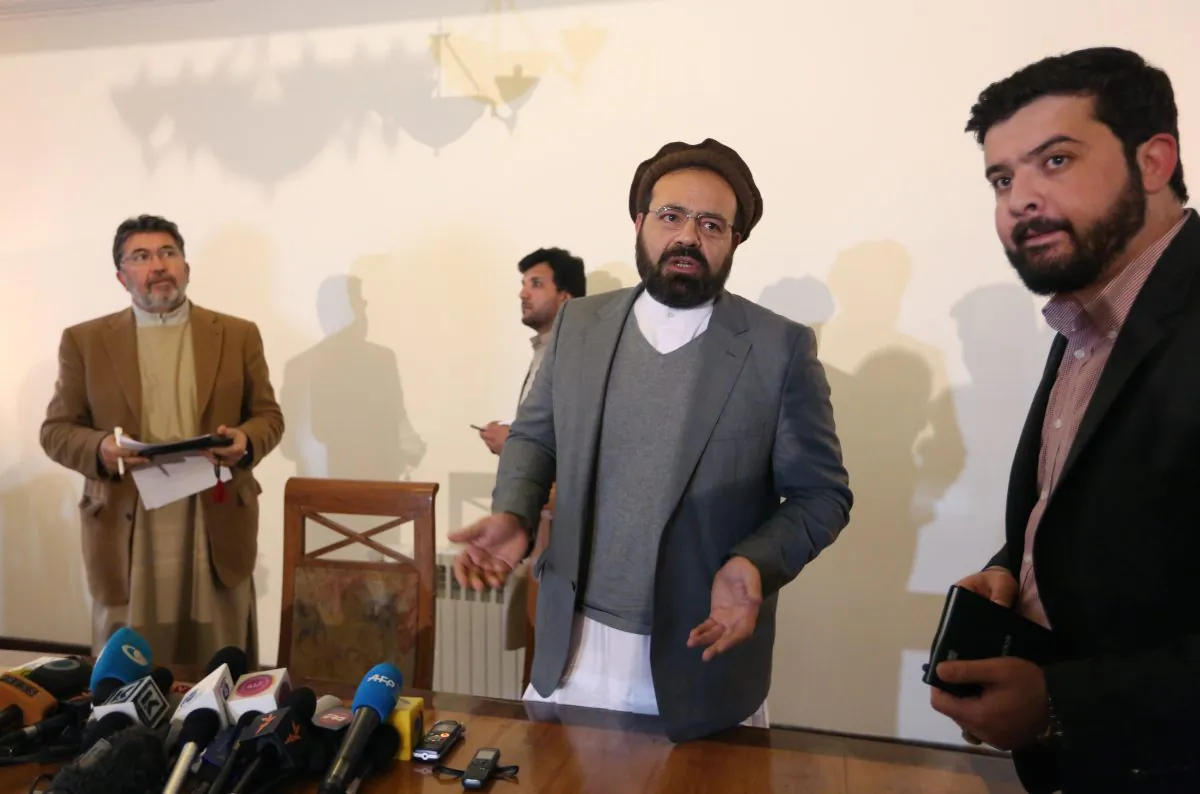 Amin Karim (2nd R), an official of the Hezb-i-Islami Party, speaks as he leaves after a press conference in Kabul, Afghanistan, on March 17, 2016. An Afghan official says the government will finalize a peace deal with a notorious militant insurgent group within days. Ataullah Saleem, a deputy head of Kabul's High Peace Council, said on Saturday, May 14, an agreement with the armed wing of Hezb-i-Islami could be completed Sunday, after two years of negotiations. (AP Photo/Rahmat Gul)