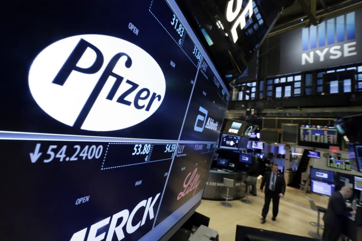 The Pfizer logo on a screen above its trading post on the floor of the New York Stock Exchange on April 6, 2016. (AP Photo/Richard Drew)
