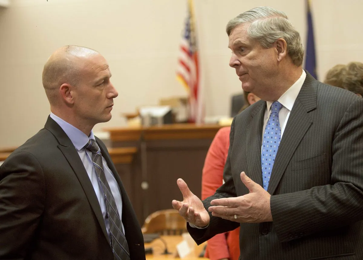 U.S. Secretary of Agriculture Tom Vilsack (R) talks with former heroin addict Chris Overka after a meeting at the Hillsborough County Superior Court in Nashua, N.H., on May 9, 2016. Vilsack, who has been candid about his mother's struggles with alcohol and pills, is leading an Obama administration initiative on rural opioid abuse. He visited Hillsborough County Superior Court in Nashua on Monday to hear about its drug court program, which held its first graduation ceremony last week. (AP Photo/Jim Cole)