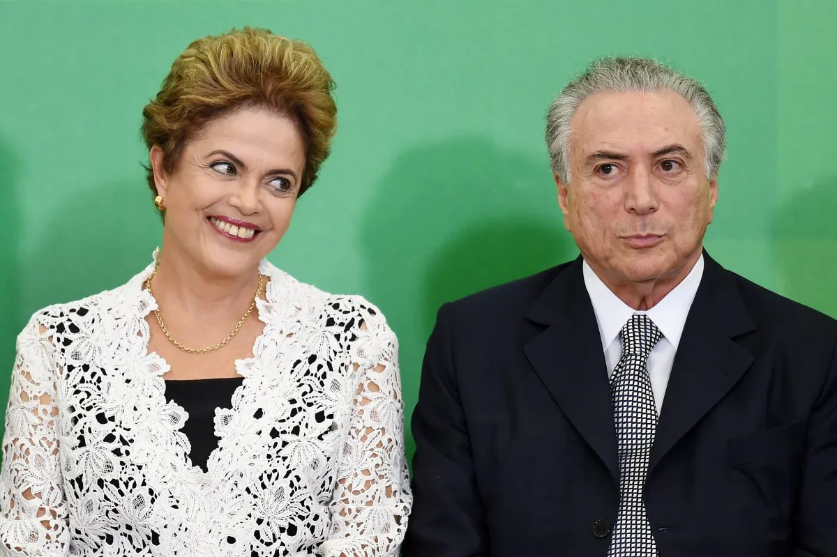 Brazilian President Dilma Rousseff (L) and her Vice President Michel Temer attend the inauguration ceremony of new ministers at the Planalto Palace in Brasilia on Oct. 5, 2015. (Evaristo Sa/AFP/Getty Images)