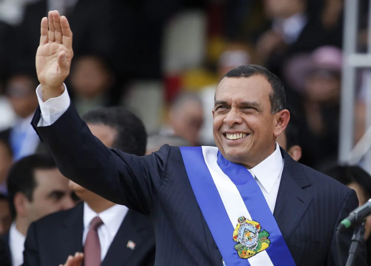 FILE - In this Jan. 27, 2010 file photo, Honduras' President Porfirio Lobo, waves during his presidential inauguration ceremony in Tegucigalpa, Honduras. (AP Photo/Eduardo Verdugo, File)