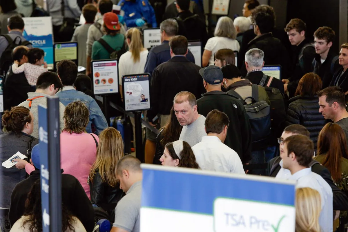 A long line of travelers wait for the TSA security check point at O'Hare International airport, May 16, 2016, in Chicago. Already faced with lines that snake through terminals out to the curb, fliers are bracing for long waits at security in the busy months of July and August. Some major airports are currently seeing wait times exceeding 90 minutes at peak hours. (AP Photo/Teresa Crawford)