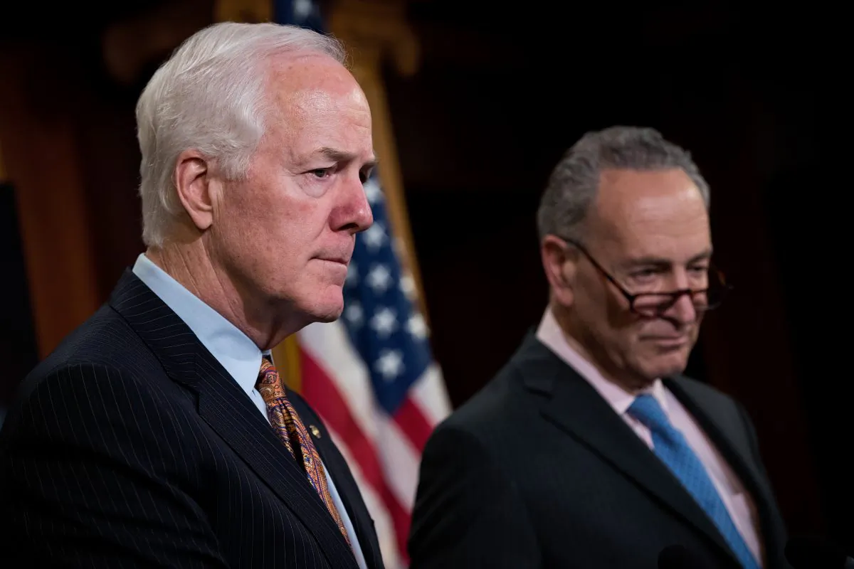 (L-R) Sens. John Cornyn (R-Texas) and Chuck Schumer (D-N.Y.) answer questions during a news conference, in a file photo. (Drew Angerer/Getty Images)
