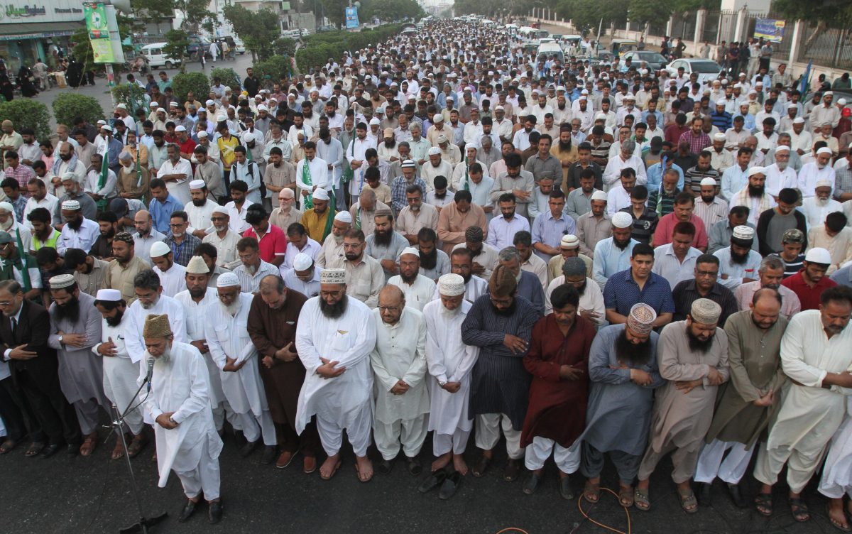 Supporters of Pakistani religious party Jamaat-i-Islami offer prayers for Bangladesh's Jamaat-i-Islami party chief Motiur Rahman Nizami, in Karachi, Pakistan, on May 11, 2016. The head of Bangladesh's largest Islamist party was executed early on May 11 for his role in acts of genocide and war crimes during the country's independence war against Pakistan in 1971, a senior government official said. (AP Photo/Fareed Khan)
