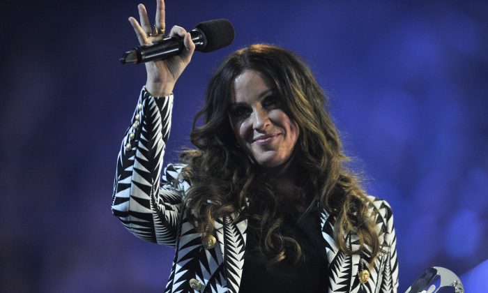 Alanis Morissette is presented an award at the 2015 JUNO Awards at FirstOntario Centre on March 15, 2015 in Hamilton, Canada.  (Photo by Sonia Recchia/Getty Images)