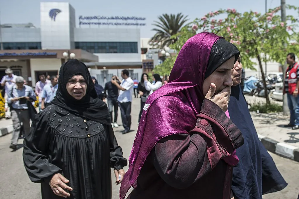 Family members of passengers who were flying aboard an EgyptAir plane that vanished from radar en route from Paris to Cairo overnight get ready to be transported by bus to a gathering point at Cairo airport on May 19, 2016. (KHALED DESOUKI/AFP/Getty Images)