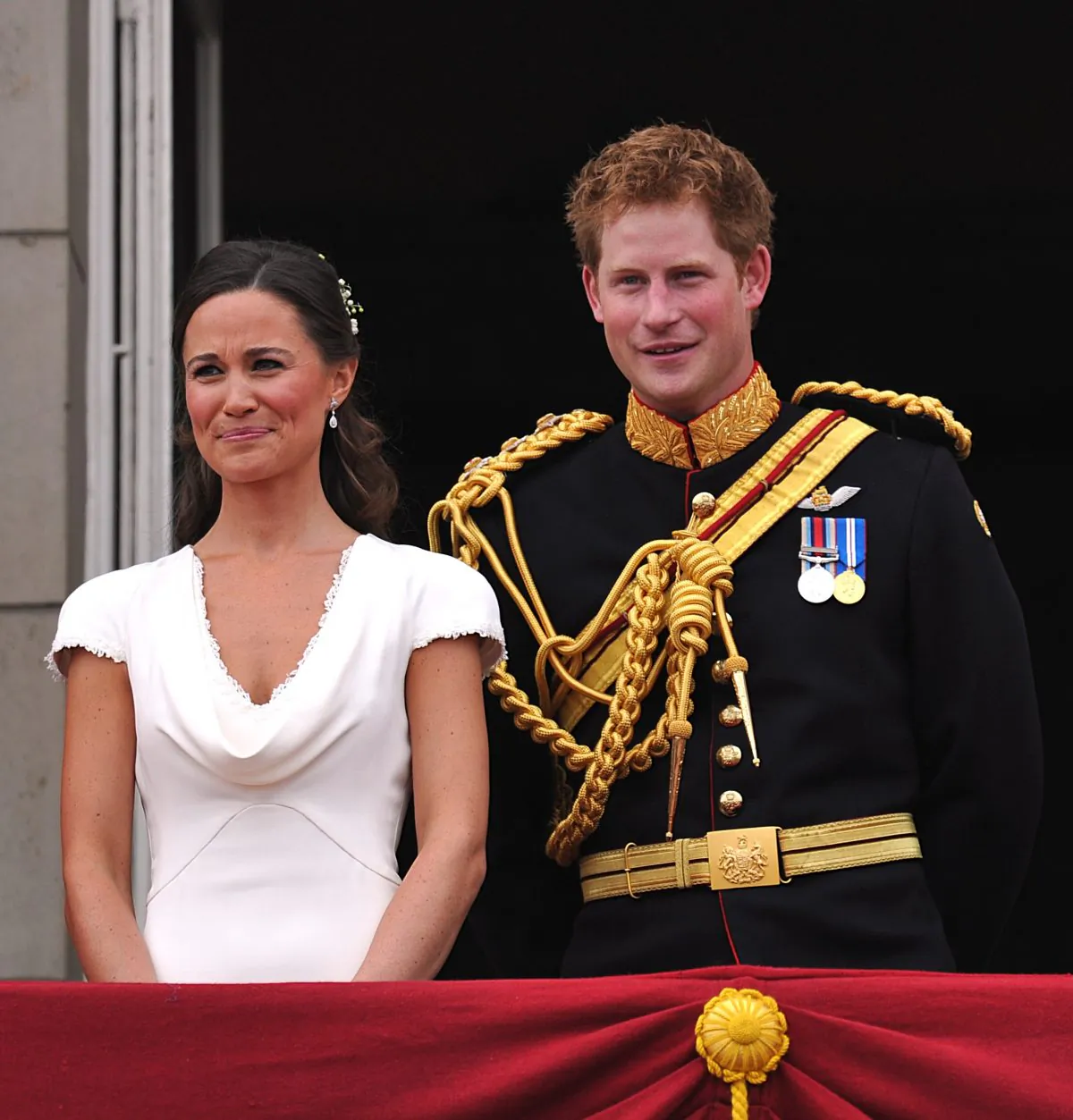 Best man Prince Harry and Maid of Honor Pippa Middleton on the balcony at Buckingham Palace after the Royal Wedding of Prince William to Catherine Middleton on April 29, 2011 in London, England. (Photo by John Stillwell-WPA Pool/Getty Images)