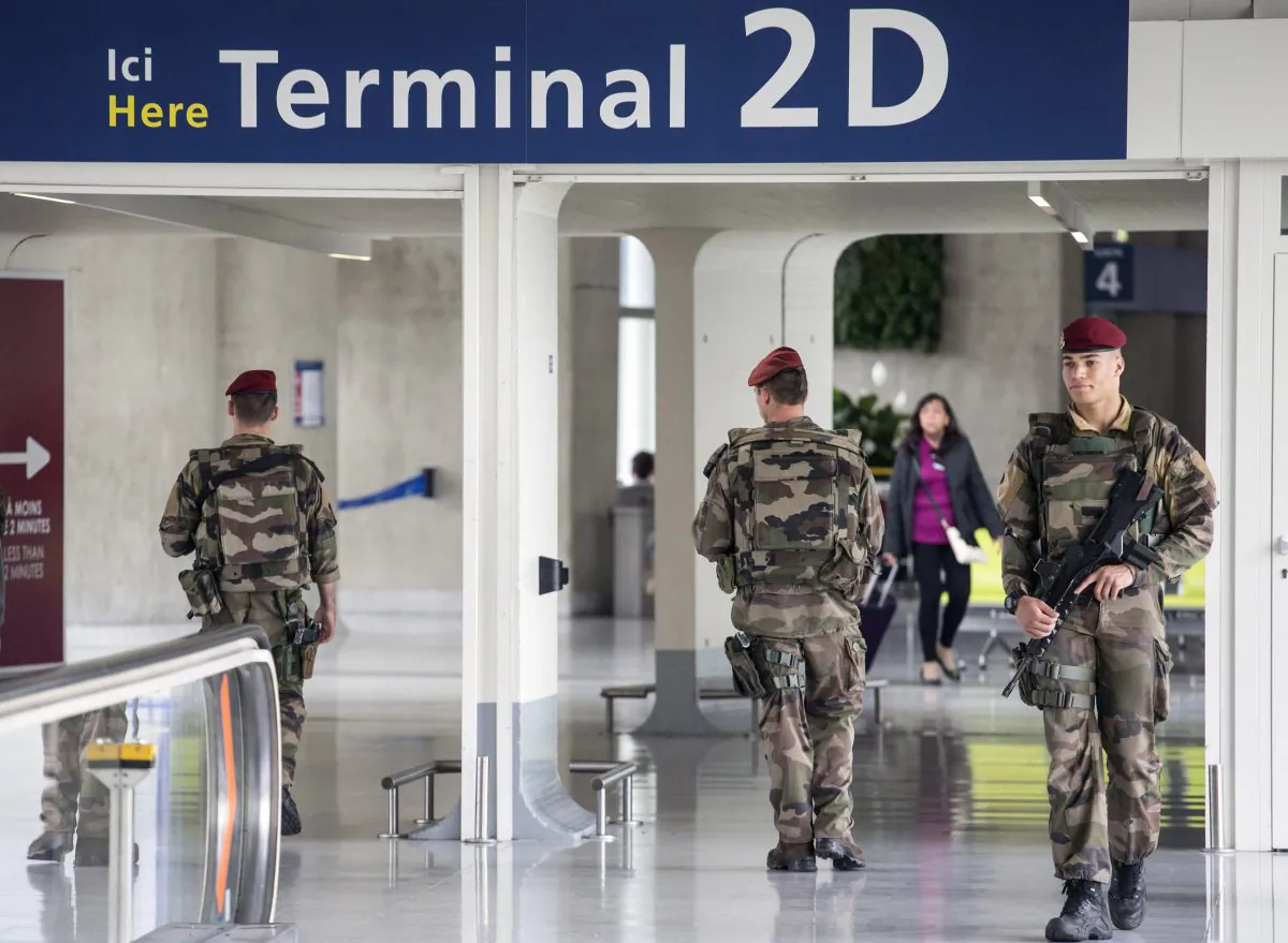 French soldiers patrol at Charles de Gaulle airport, outside of Paris, Friday, May 20, 2016. (AP Photo/Laurent Cipriani)