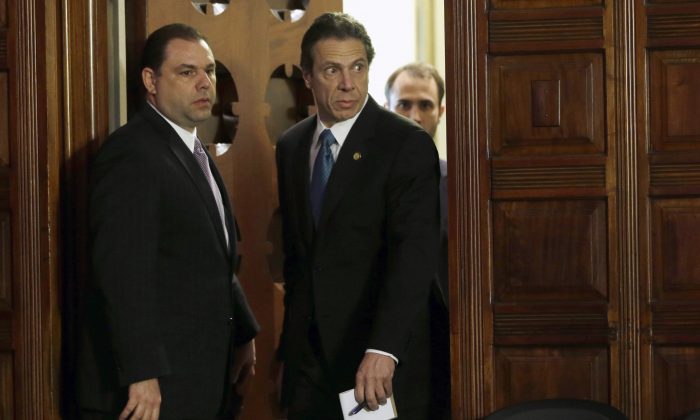 New York Gov. Andrew Cuomo (R) and Joseph Percoco, executive deputy secretary, stand at a press conference in Albany, N.Y., on April 26, 2013. (Mike Groll, File/AP Photo)
