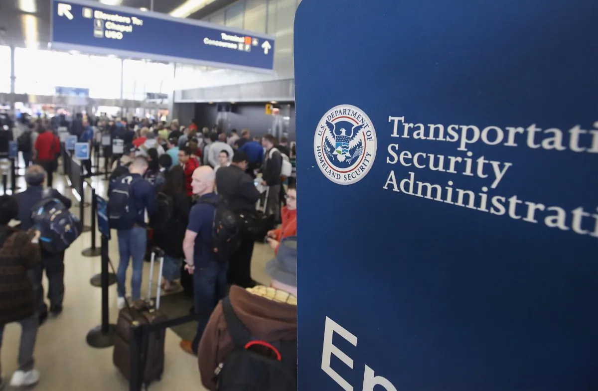 Passengers at O'Hare International Airport wait in line to be screened at a Transportation Security Administration checkpoint, in Chicago on May 16, 2016. (Scott Olson/Getty Images)