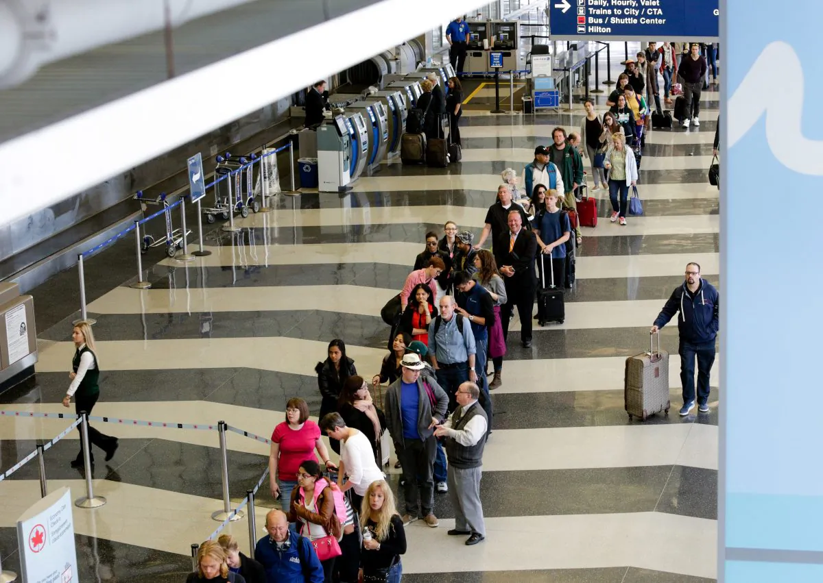 FILE - In this May 16, 2016 file photo, a long line of travelers waiting for the TSA security check point at O'Hare International airport in Chicago. The Transportation Security Administration (TSA) has ousted its head of security operations and put new leadership in charge of screening operations at a major international airport, but long checkpoint lines and travel headaches already pervading the busy summer travel season are likely to continue. (AP Photo/Teresa Crawford, File)