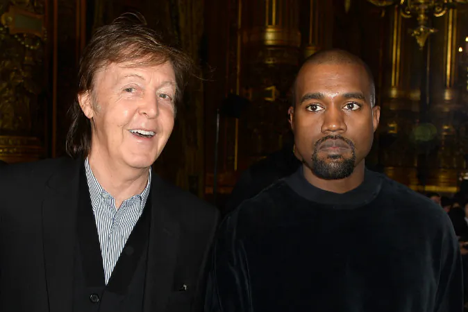 (L-R) Paul McCartney and Kanye West attend the Stella McCartney show as part of the Paris Fashion Week Womenswear Fall/Winter 2015/2016 on March 9, 2015 in Paris, France. (Pascal Le Segretain/Getty Images)