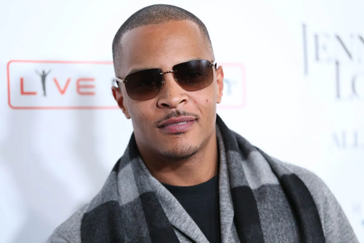 FILE- In this Jan. 20, 2016, file photo, T.I. arrives at the grand opening of "Jennifer Lopez: All I Have" show at Planet Hollywood Resort & Casino in Las Vegas. According to authorities several people were shot at a T.I concert in New York, Wednesday, May 25, 2016. (Photo by Omar Vega/Invision/AP, File)