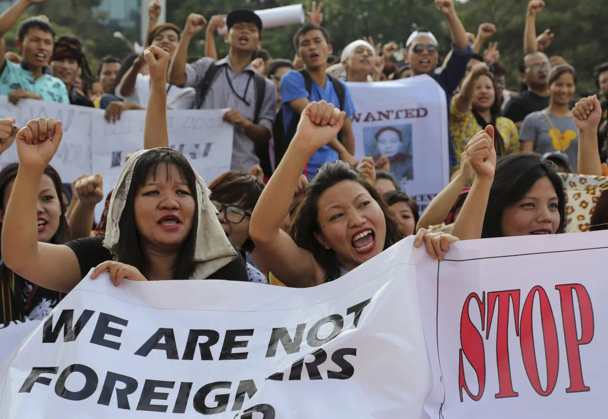 Members of Manipur Tribal Union shout slogans during a protest against new legislation defining who can claim to be from the northeastern Indian state of Manipur, in Bangalore, India, on Sept. 4, 2015. (AP Photo/Aijaz Rahi)