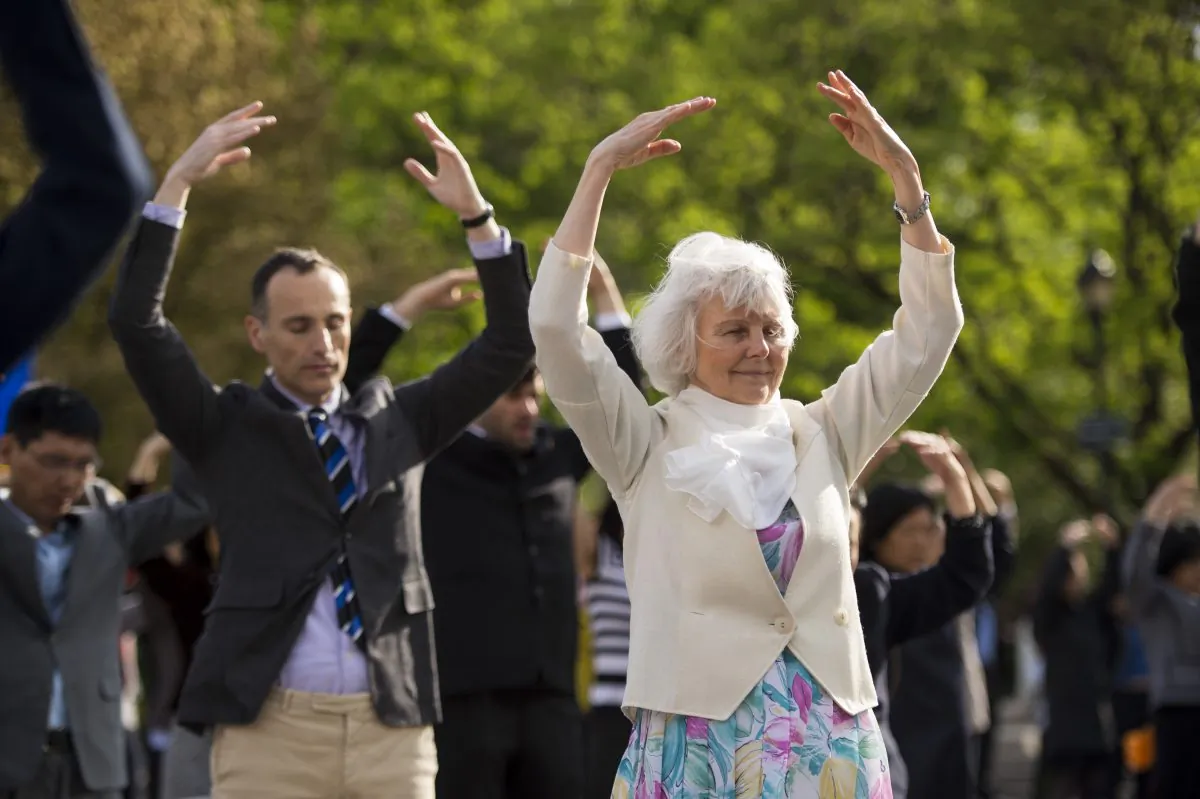 People practice the Falun Dafa exercises at Union Square in Manhattan on May 13, 2014. (Edward Dye/Epoch Times)