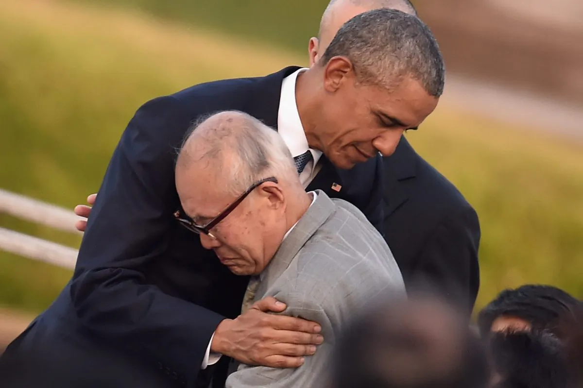 U.S. President Barack Obama embraces an a-bomb victim at the Hiroshima Peace Memorial Park on May 27, 2016 in Hiroshima, Japan. (Photo by Atsushi Tomura/Getty Images)