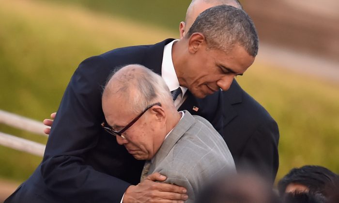 U.S. President Barack Obama embraces an a-bomb victim at the Hiroshima Peace Memorial Park on May 27, 2016 in Hiroshima, Japan. (Photo by Atsushi Tomura/Getty Images)