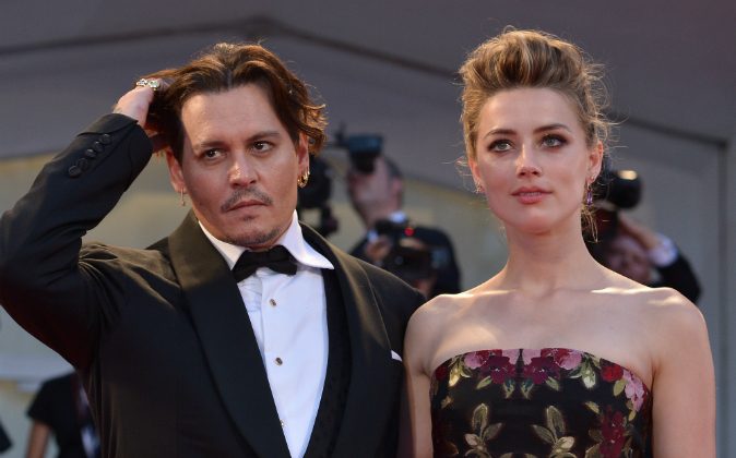 US actress Amber Heard arrives with her husband US actor Johnny Depp for the screening of the movie 'The Danish Girl' presented in competition at the 72nd Venice International Film Festival on September 5, 2015 at Venice Lido. (TIZIANA FABI/AFP/Getty Images)