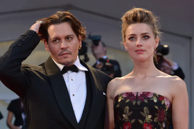 US actress Amber Heard arrives with her husband US actor Johnny Depp for the screening of the movie 'The Danish Girl' presented in competition at the 72nd Venice International Film Festival on September 5, 2015 at Venice Lido. (TIZIANA FABI/AFP/Getty Images)