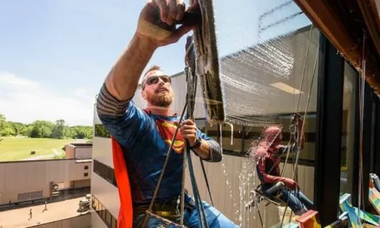 Window Washers Dress up as Superheroes to Clean Windows of Children’s Hospital