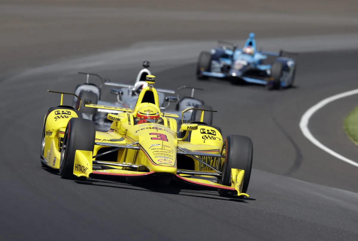 Helio Castroneves, of Brazil, drives through turn one during the final practice session for the Indianapolis 500 auto race at Indianapolis Motor Speedway in Indianapolis, Friday, May 27, 2016. (AP Photo/Michael Conroy)