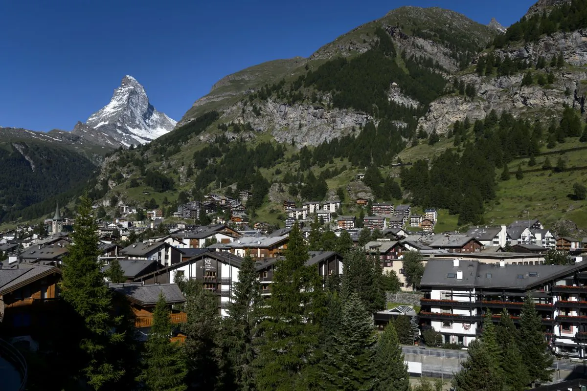 A Swiss village with Matterhorn mountain in the background. (FABRICE COFFRINI/AFP/Getty Images)