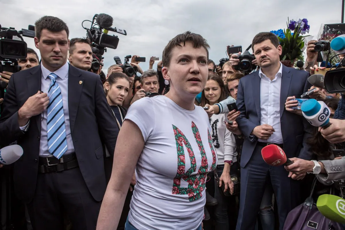 Ukrainian military pilot and Member of Parliament Nadiya Savchenko is surrounded by media upon her arrival at Kyiv Boryspil Airport, in Boryspil, Ukraine, on May 25, 2016. Savchenko was captured while fighting Russia-backed rebels in eastern Ukraine and put on trial in Russia on charges that she was complicit in the deaths of two Russian journalists. In March, she was convicted and sentenced to 22 years in prison, but was reportedly swapped for two Russian fighters captured by Ukrainian forces. (Brendan Hoffman/Getty Images)