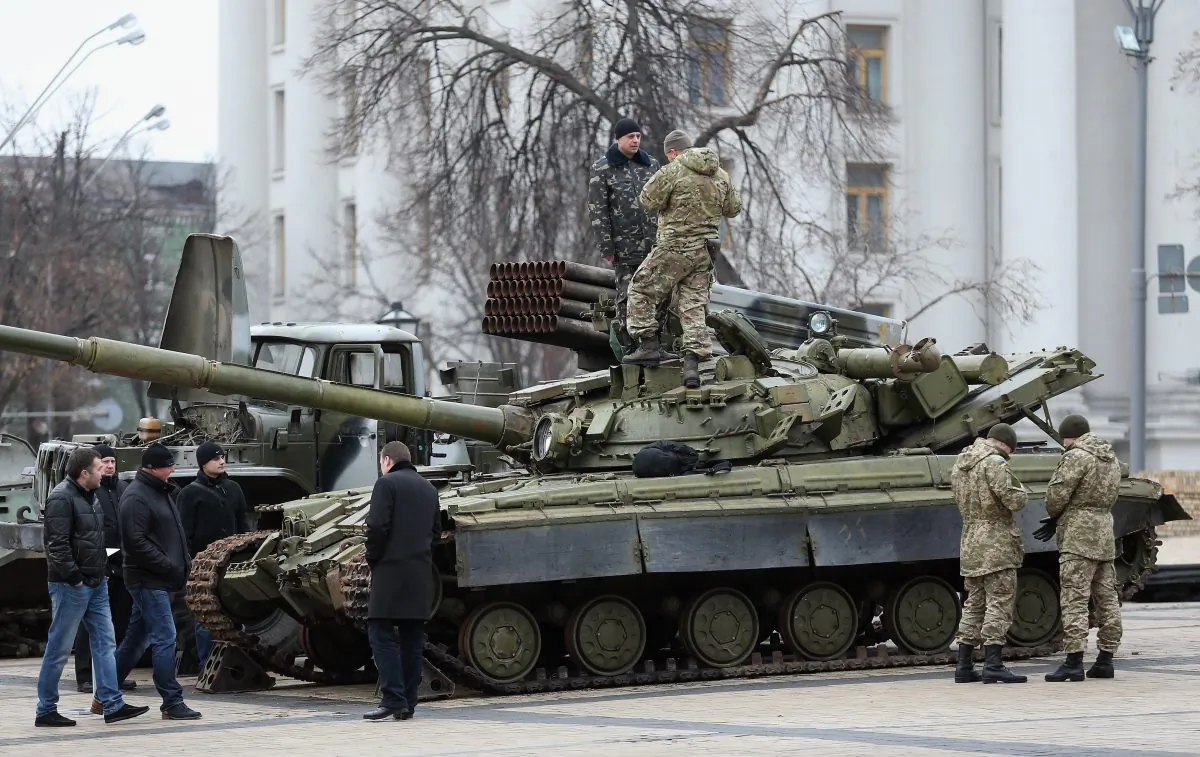Security forces inspect a heavy tank and a rocket launcher truck on Feb. 22, 2015, in Kiev, Ukraine, in an exhibition the Ukrainian government says demonstrates Russian involvement in recent conflicts. A new report from RAND Corporation says Russia, China, and Iran are using "short of war" methods in modern conflicts. (Sean Gallup/Getty Images)