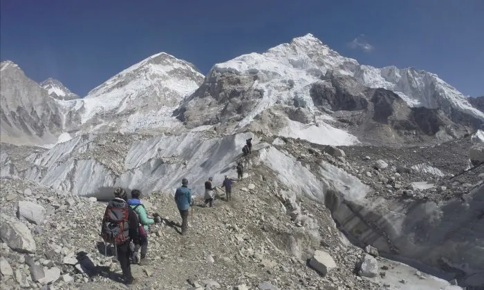 Nearly 300 people have died on Mt. Everest in the century or so since climbers have been trying to reach its summit. At least 100 of them are still on the mountain, perhaps 200. (AP Photo/Tashi Sherpa)