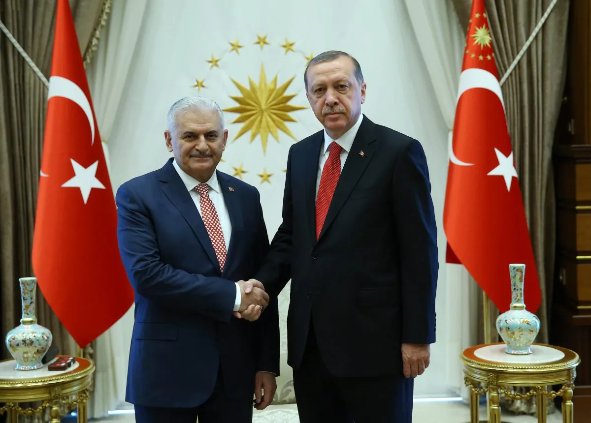Turkish President Recep Tayyip Erdogan (R) with Binali Yildirim, the ruling party's new chairman and new prime minister, prior to their talks at the Presidential Palace in Ankara, Turkey, on May 24, 2016. (Presidential Press Service via AP)