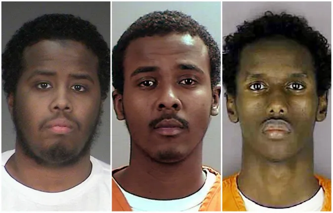 22-year-old Mohamed Farah, left, 22-year-old Abdirahman Daud, middle, and 21-year-old Guled Omar have all been found guilty for conspiring to support ISIL. (Hennepin County Sheriff's Office/AP)