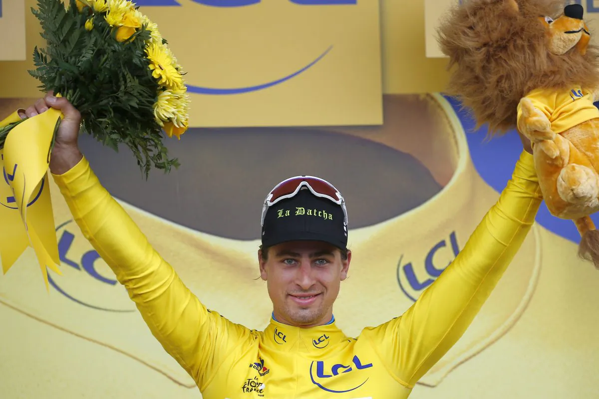 Peter Sagan celebrates on the podium after winning Stage 2 of the Tour de France, 183 kilometers (113.7 miles) from Saint-Lo to Cherbourg-en-Cotentin, France, Sunday, July 3, 2016. (AP Photo/Peter Dejong)