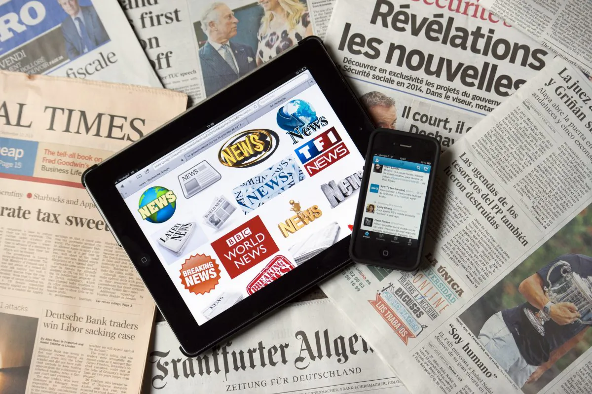A tablet and a smartphone connected on news websites and world newspapers, in Paris, France, on Sept. 12, 2013. (Lionel Bonaventure/AFP/Getty Images)