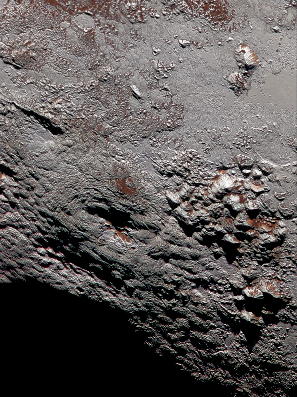 Scientists with NASA’s New Horizons mission have assembled this highest-resolution color view of one of two potential cryovolcanoes spotted on the surface of Pluto by the New Horizons spacecraft in July 2015. (NASA/JHUAPL/SwRI)