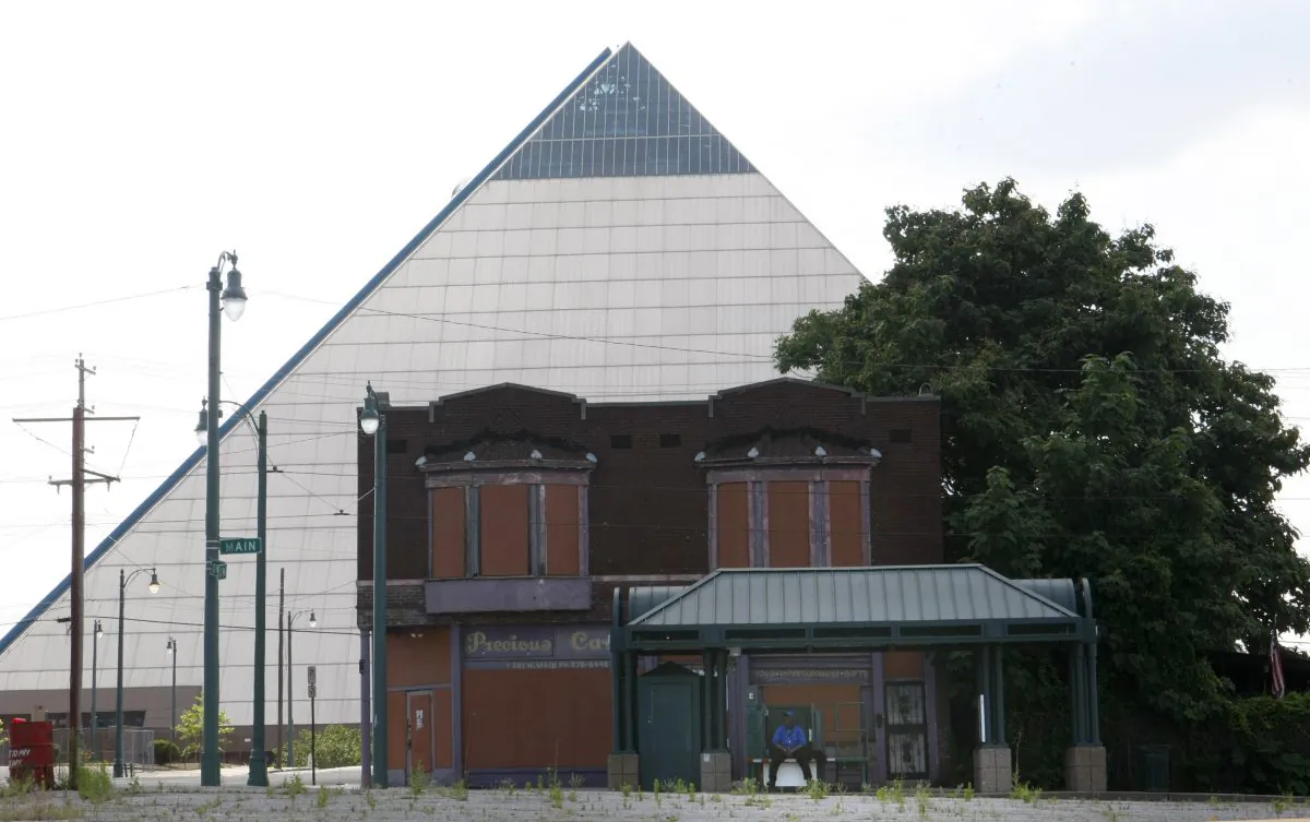 Vacant buildings stand near the Pyramid which houses a Bass Pro Shops megastore that opened in 2015, in Memphis, Tenn., on June 1, 2016. Statistics describe an America that is nearly recovered from the Great Recession, but the national averages don't give a complete or accurate picture. Wealth is flowing disproportionately to the rich, skewing the data used to measure economic health. (AP Photo/Karen Pulfer Focht)