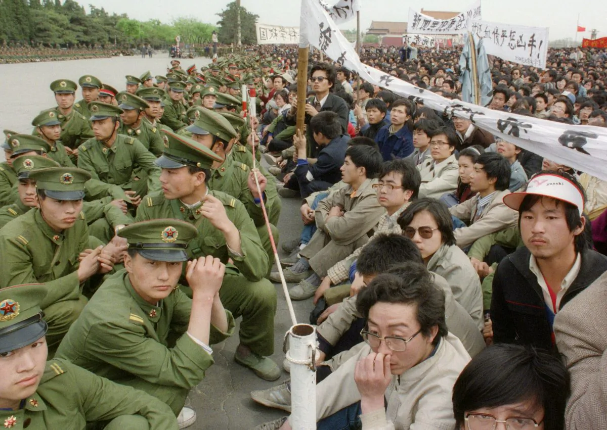 Several hundred of 200,000 pro-democracy student protesters face to face with policemen outside the Great Hall of the People in Tiananmen Square in Beijing on April 22, 1989. (Catherine Henriette/AFP/Getty Images)