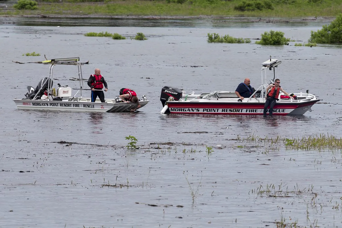 Morgan's Point Resort Fire and Rescue works on Lake Belton near the scene of an accident at Fort Hood at Owl Creek Park near Gatesville, Texas, on Thursday, June 2, 2016. (Michael Miller/The Temple Daily Telegram via AP)