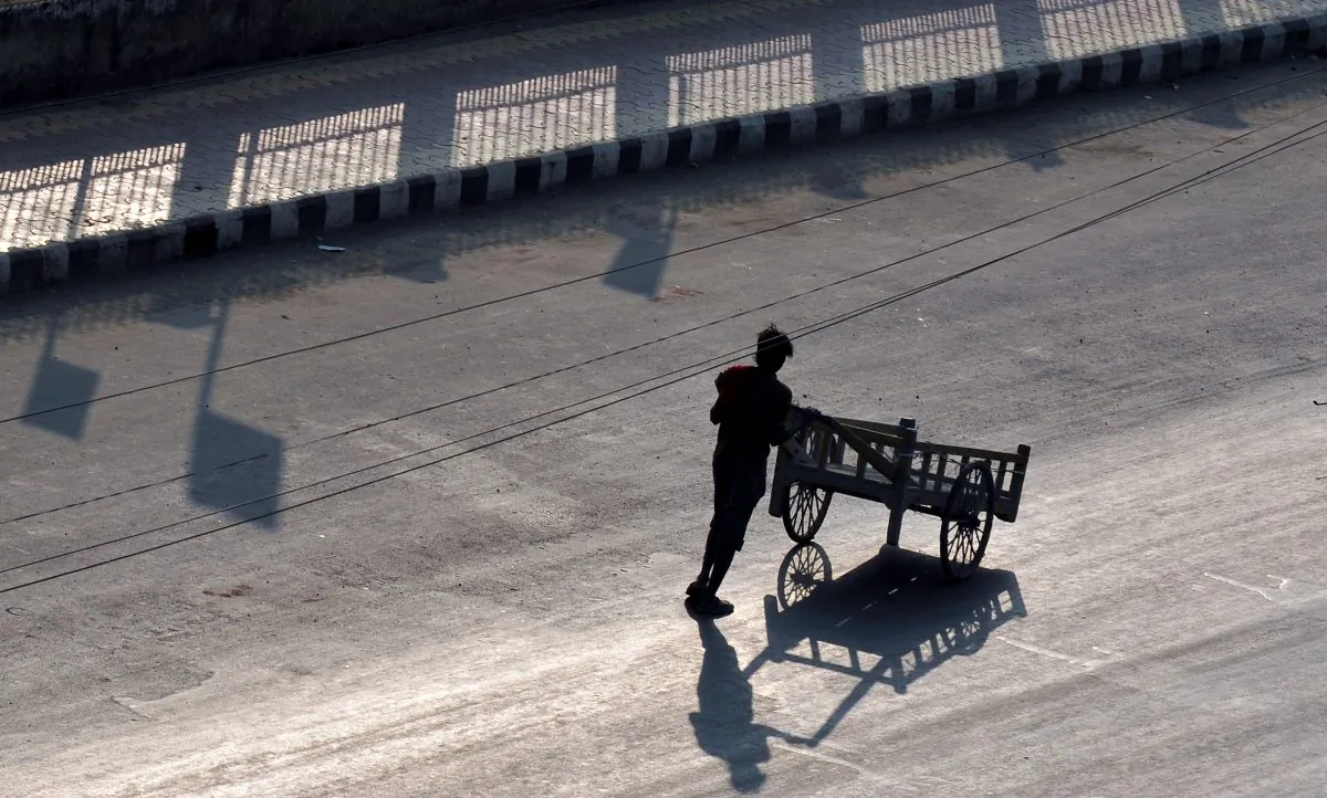 A labourer pushes a handcart on a street in Imphal in the northeastern state of Manipur on Feb. 20, 2012. Promoted in official tourist brochures as the "jewel of India," the tiny state of Manipur often seems closer to an ignored family heirloom than a proudly coveted gem. (Manjunath Kiran/AFP/GettyImages)