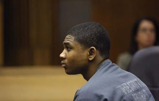 In this June 30, 2010 photo, Davontae Sanford sits in court as attorneys present their findings in Detroit. Sanford was just 14 when he told police he killed four people in a drug den. He was sentenced to at least 38 years in prison for the 2007 slayings, which police say were planned as a robbery but now insists his confession was a lie. (AP Photo/Carlos Osorio)