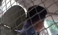 Chinese Policeman Forces Two Girls into Patrol Car, Tells Them They’ll ‘Enjoy’ Being Locked Up With Criminals and HIV-Positives