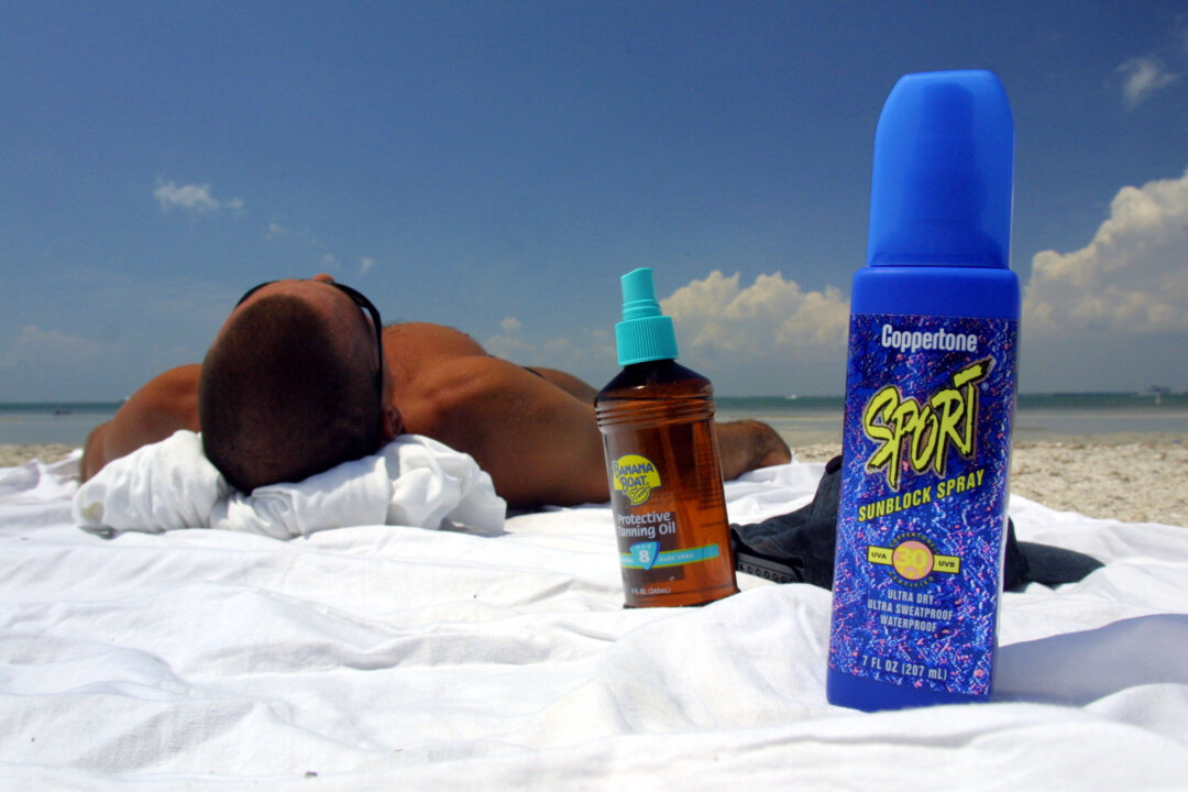 Five kinds of SPF 50 aerosol Coppertone sunscreens (not pictured here) have been recalled for containing a cancer-causing chemical. (Joe Raedle/Getty Images)