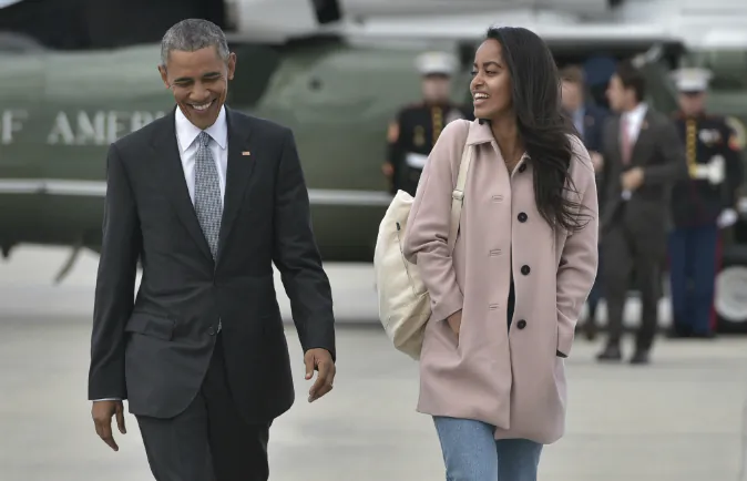US President Barack Obama and daughter Malia make their way to board Air Force One before departing from Chicago OHare International Airport in Chicago on April 7, 2016. Obama is heading to Los Angeles to attend fundraisers. (MANDEL NGAN/AFP/Getty Images)